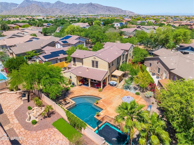 20639 W Grandview Dr, Buckeye, AZ 85396 - aerial perspective of suburban area featuring a pool and a mountain backdrop