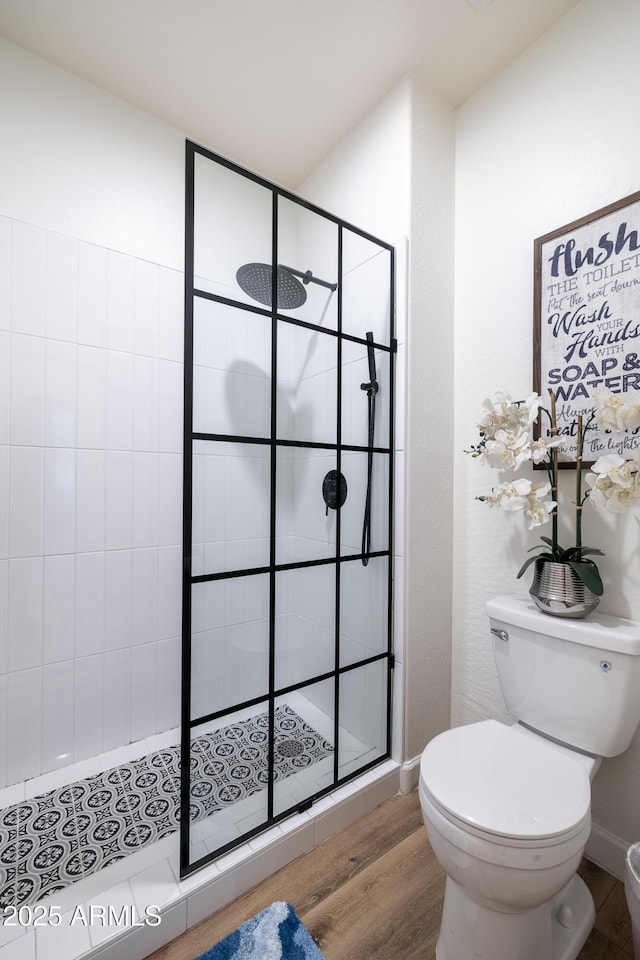 20639 W Grandview Dr, Buckeye, AZ 85396 - bathroom featuring toilet, wood finished floors, and tiled shower