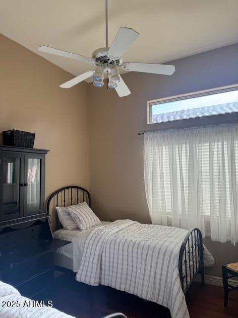 bedroom featuring dark hardwood / wood-style floors and ceiling fan