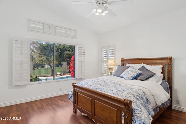 bedroom with vaulted ceiling, dark hardwood / wood-style floors, and ceiling fan