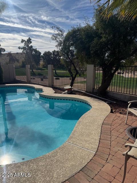 view of swimming pool featuring a patio area