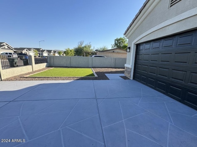 view of patio / terrace with a garage