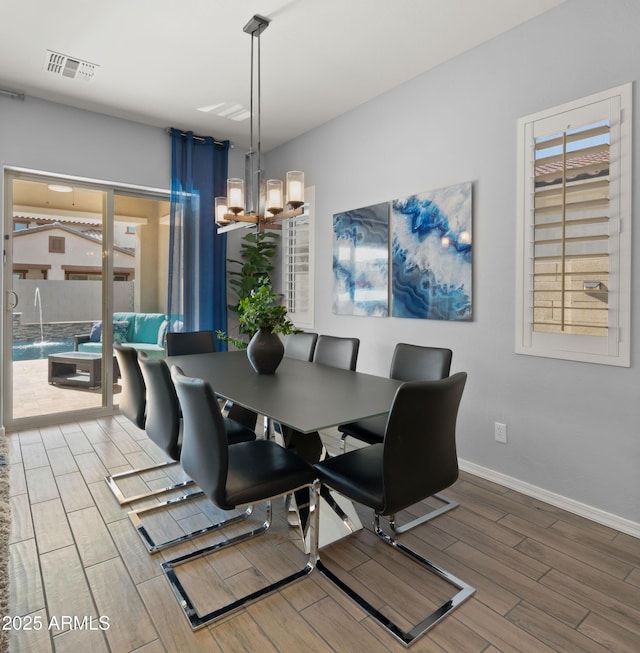 dining space with a notable chandelier