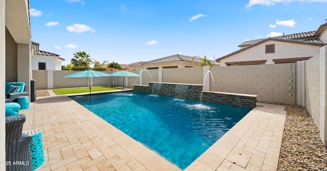 view of swimming pool with a patio and pool water feature