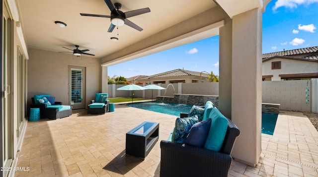 view of patio / terrace with an outdoor living space, pool water feature, a fenced in pool, and ceiling fan