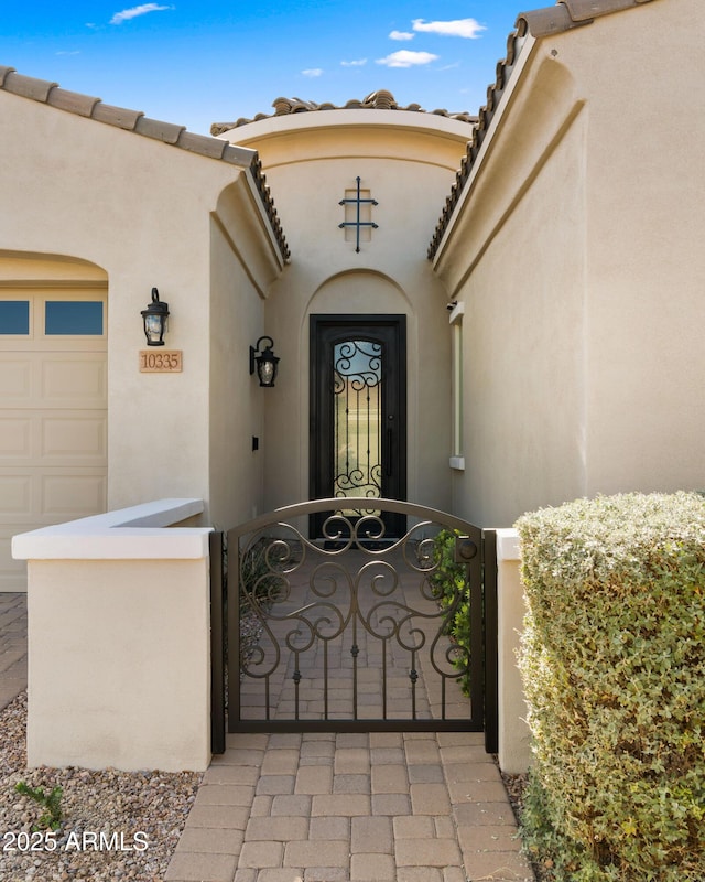 doorway to property featuring a garage