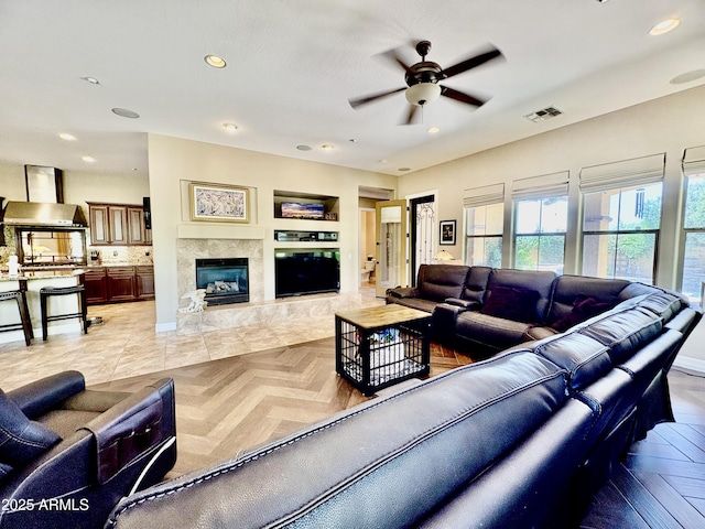 9249 E Desert Arroyos St, Scottsdale, AZ 85255 - living room featuring a ceiling fan, recessed lighting, and a tile fireplace