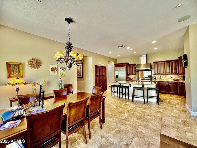 9249 E Desert Arroyos St, Scottsdale, AZ 85255 - dining area with a chandelier and recessed lighting