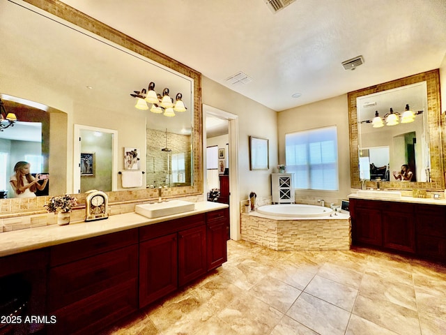 9249 E Desert Arroyos St, Scottsdale, AZ 85255 - bathroom with a bath, tiled shower, two vanities, and tile patterned flooring