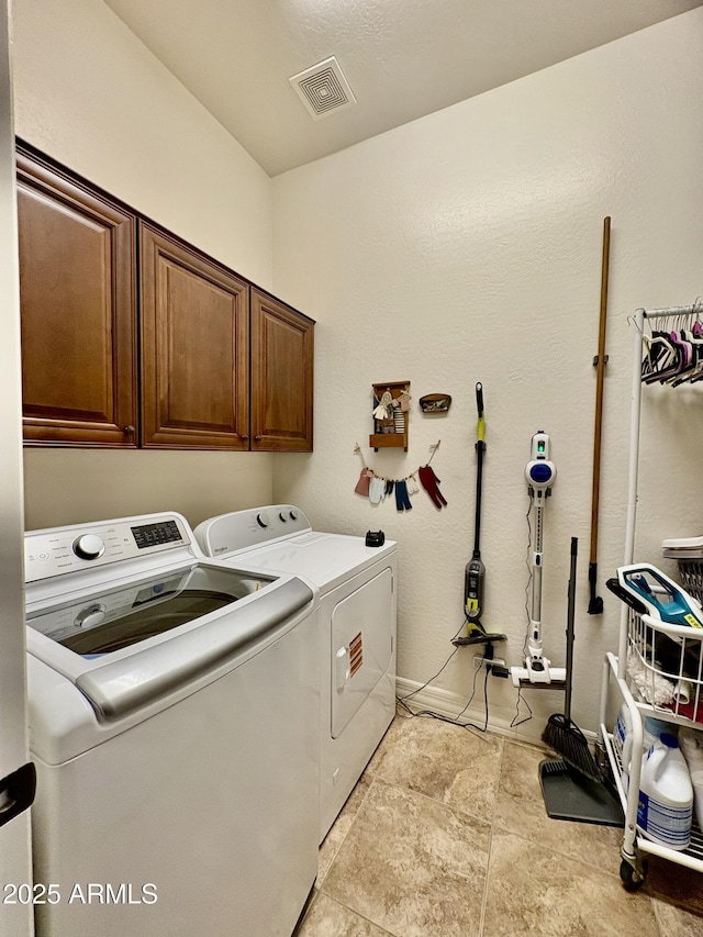 9249 E Desert Arroyos St, Scottsdale, AZ 85255 - laundry area with cabinet space and washer and clothes dryer