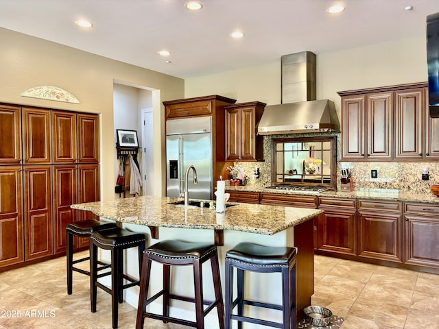 9249 E Desert Arroyos St, Scottsdale, AZ 85255 - kitchen with stainless steel appliances, wall chimney range hood, a sink, decorative backsplash, and recessed lighting