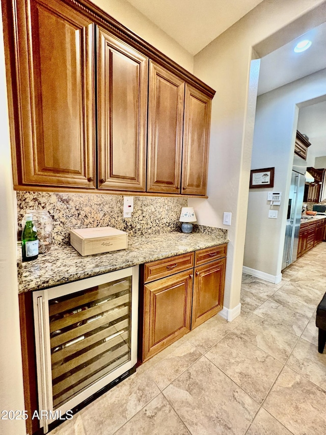 9249 E Desert Arroyos St, Scottsdale, AZ 85255 - bar area featuring wine cooler, baseboards, light tile patterned floors, and recessed lighting
