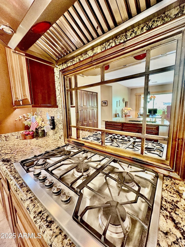 9249 E Desert Arroyos St, Scottsdale, AZ 85255 - kitchen view of stainless steel gas cooktop and wallpapered walls