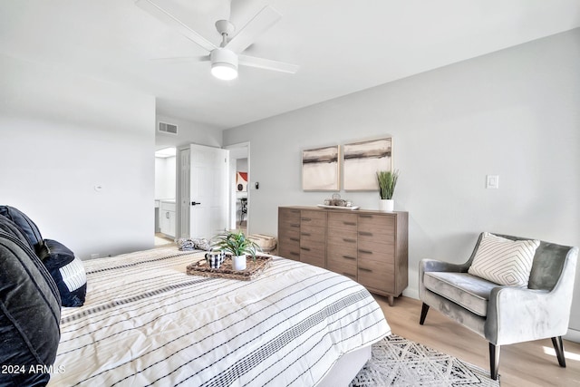 bedroom with ceiling fan and light wood-type flooring