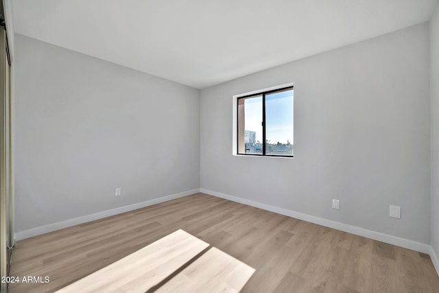 unfurnished room featuring light hardwood / wood-style flooring