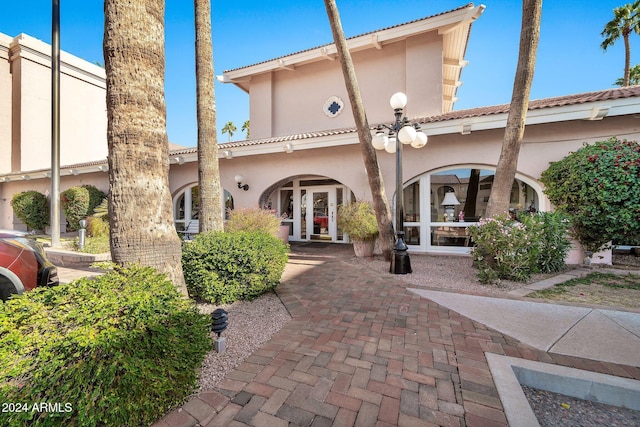 back of property featuring french doors