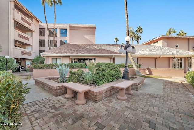 view of home's community with a patio area