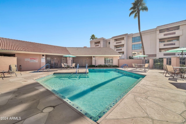 view of pool featuring a patio area