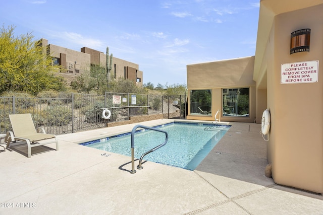 view of pool featuring a patio area