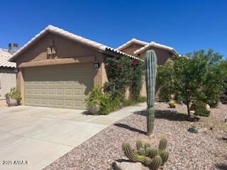 2110 E Williams Dr, Phoenix, AZ 85024 - view of front of house with driveway and a garage