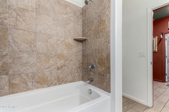 bathroom featuring tile patterned flooring and tiled shower / bath combo