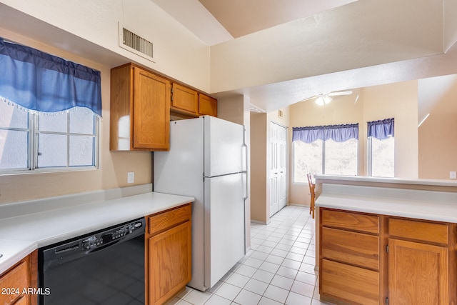 kitchen with dishwasher, light tile patterned floors, ceiling fan, and white fridge