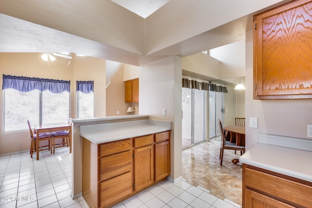 kitchen with ceiling fan and light tile patterned floors