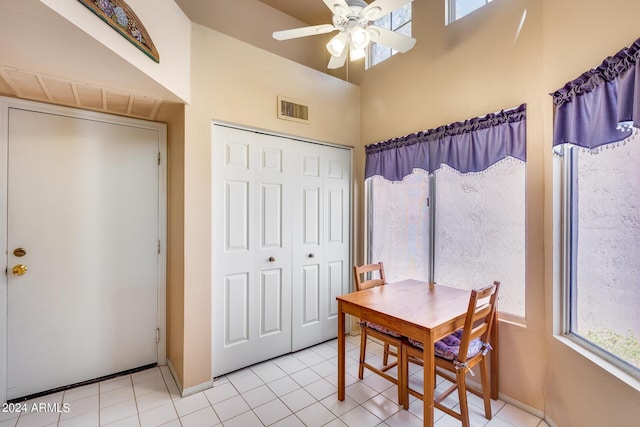 dining room with ceiling fan, visible vents, and light tile patterned flooring