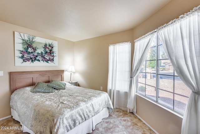 bedroom featuring baseboards