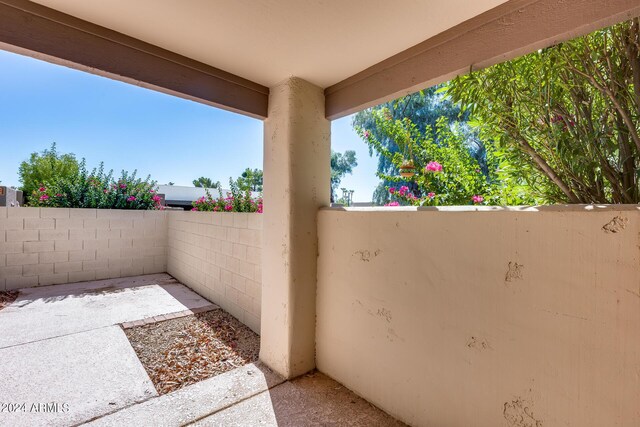 view of patio featuring fence