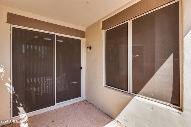 property entrance featuring stucco siding