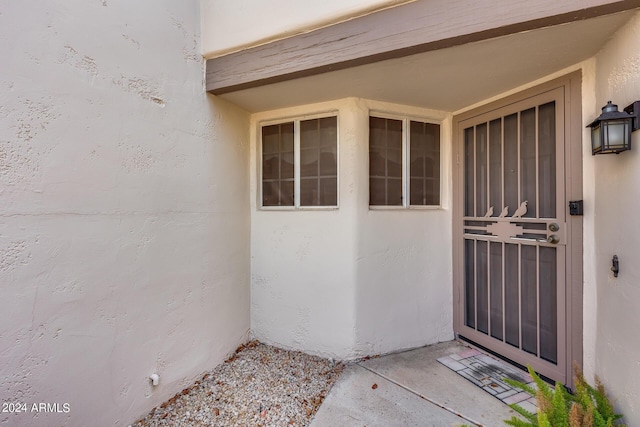 doorway to property with stucco siding