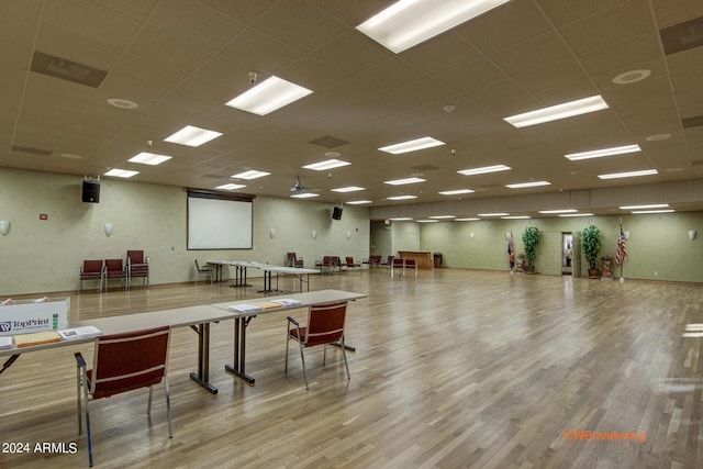 misc room featuring a paneled ceiling and light hardwood / wood-style floors