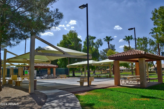 view of property's community with a yard and a gazebo