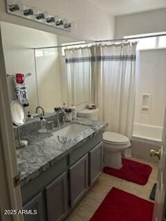 full bathroom with shower / bath combination with curtain, vanity, toilet, and tile patterned floors