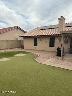 rear view of house featuring a patio