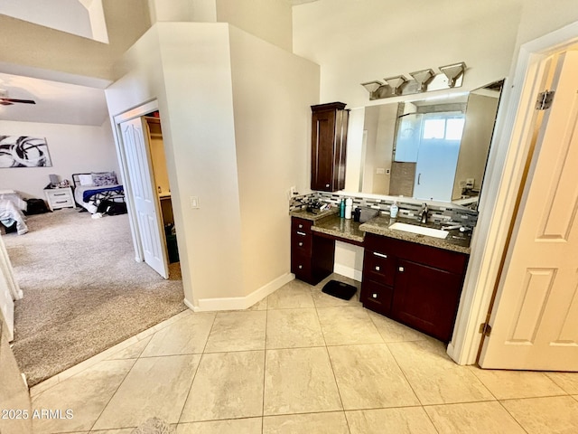 bathroom with ceiling fan, tile patterned flooring, and vanity