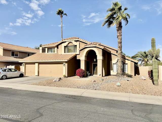 mediterranean / spanish-style house featuring a garage