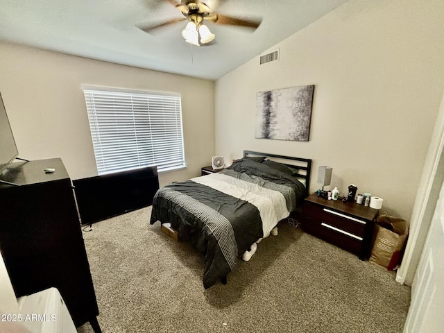 bedroom with carpet flooring, ceiling fan, and vaulted ceiling