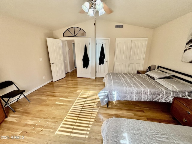 bedroom featuring ceiling fan, wood-type flooring, and vaulted ceiling