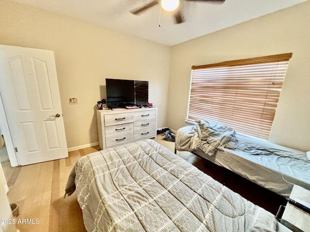 bedroom featuring light hardwood / wood-style floors and ceiling fan