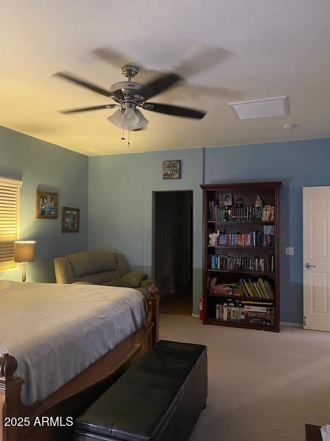 carpeted bedroom with ceiling fan