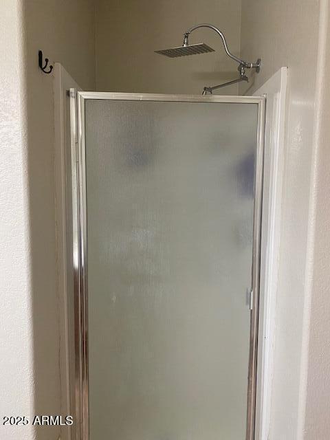 bathroom featuring a shower stall