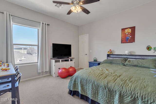 bedroom with light carpet, baseboards, visible vents, and a ceiling fan