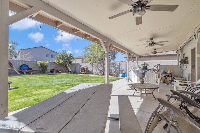 view of patio featuring a ceiling fan and a fenced backyard