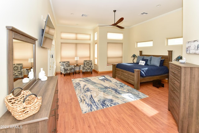 bedroom with ceiling fan, hardwood / wood-style flooring, and ornamental molding