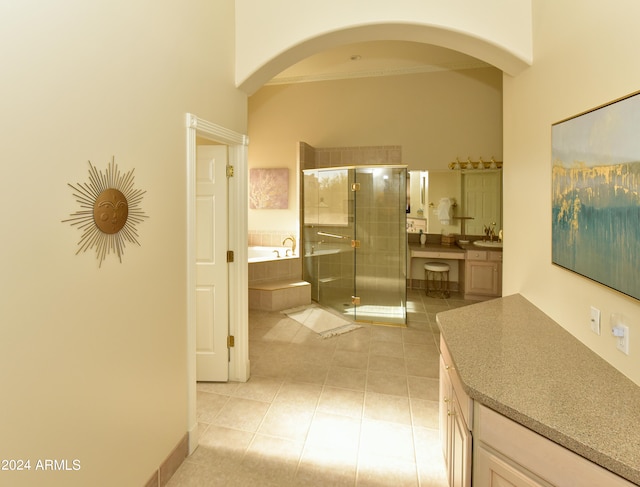 corridor with sink and light tile patterned floors