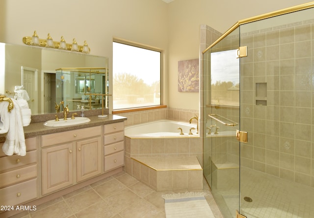 bathroom featuring vanity, plus walk in shower, and tile patterned floors