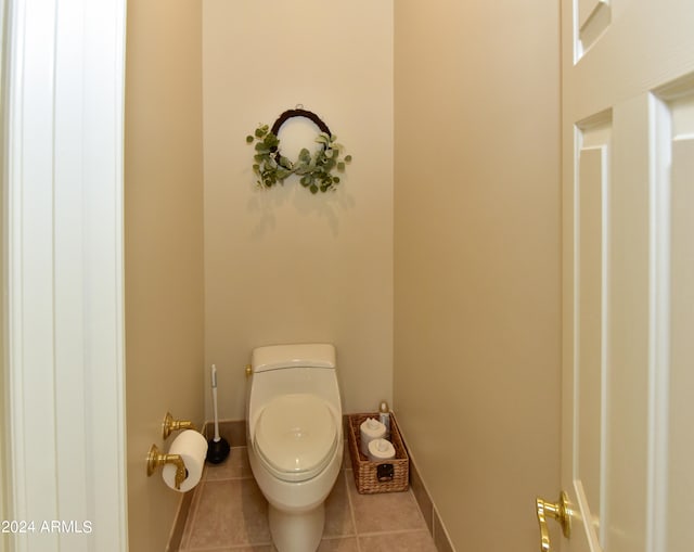 bathroom with tile patterned flooring and toilet