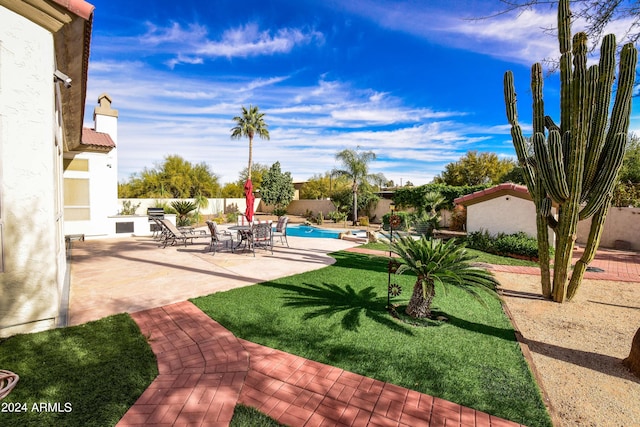 view of yard featuring a patio and a fenced in pool